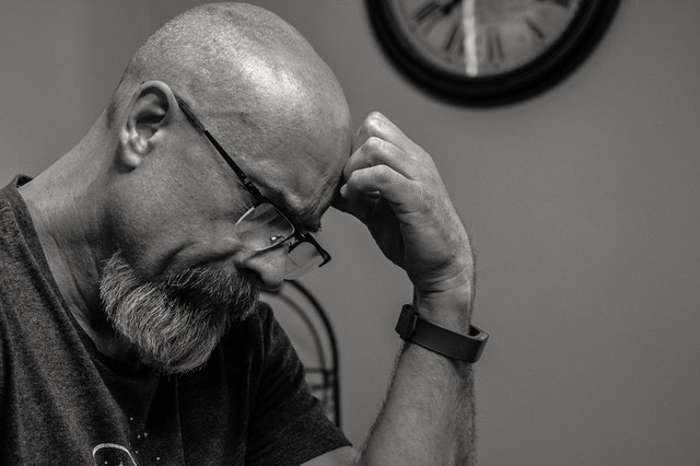 bald man thinking black and white