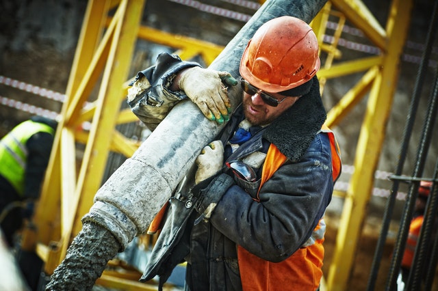 construction worker handling cement