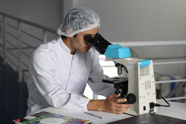 doctor using lab microscope