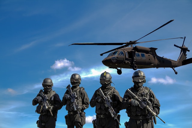 Army Soldiers and Apache Helicopter